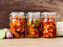 Korean food, cabbage, cucumber and radish Kimchi in three jars.